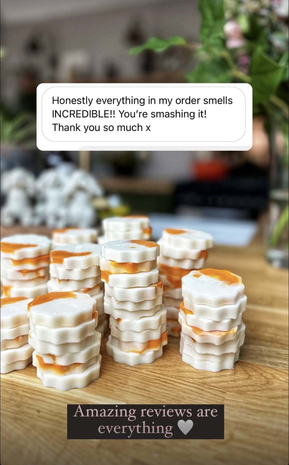 Stacks of Wax Pop products on a wooden board with text expressing satisfaction and gratitude.